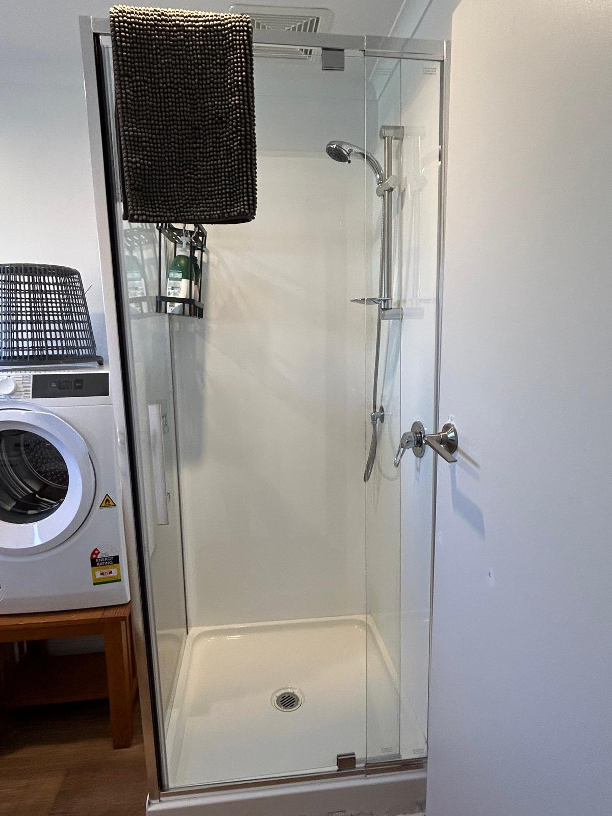 Shower in the bathroom of Apartment One