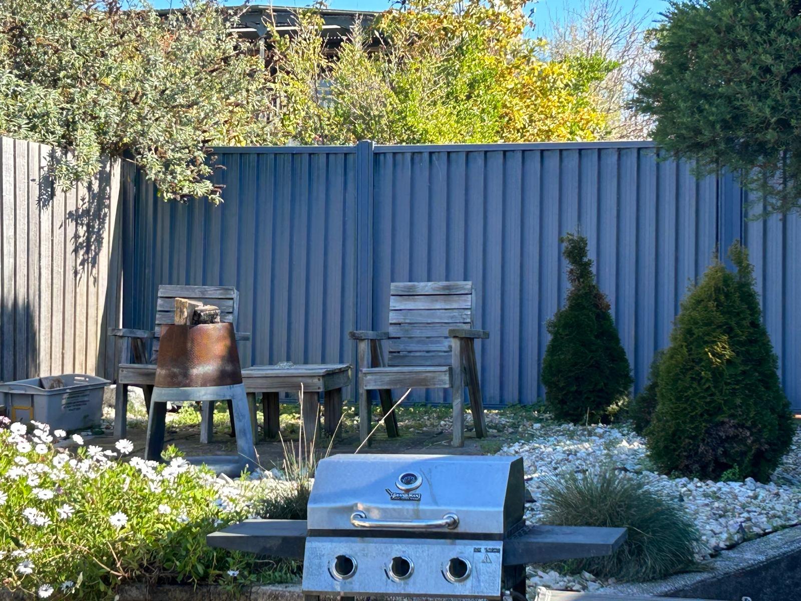 Barbeque and garden beside Apartment Three